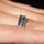 Kee's Goldtone Eternity Ring - Blue CZ