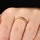 Kee's Goldtone Eternity Ring- Red CZ